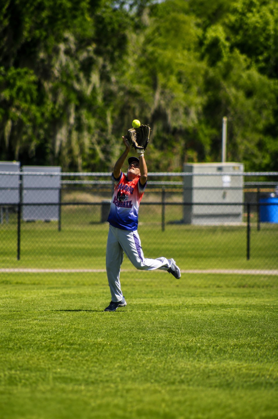 Outfielder settles in for the catch.