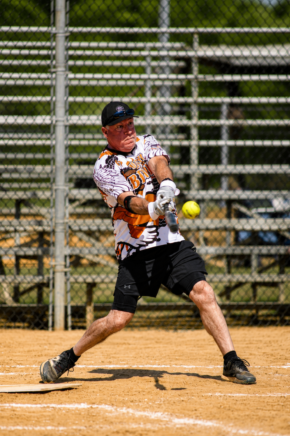 Softball player making contact at the plate